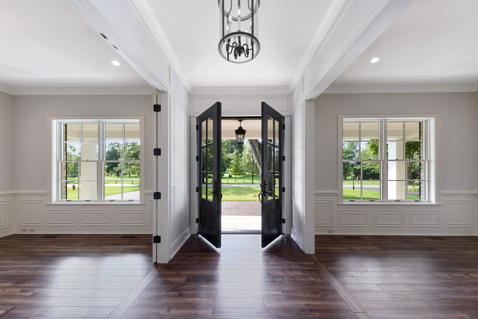 820 Country Club Road Crystal Lake, IL 60014 - Photo 5 of 48 a view of an entryway with wooden floor and windows