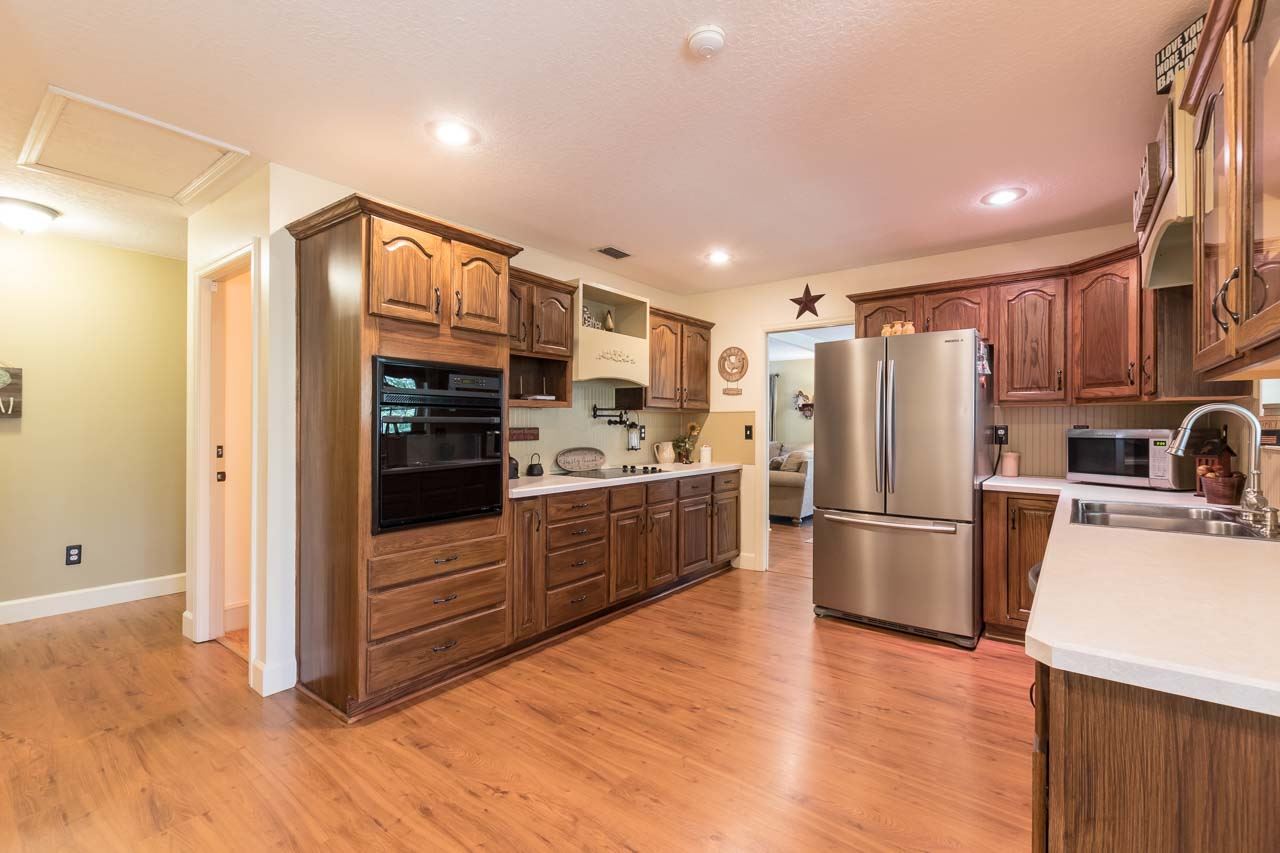 3233 Turtle Creek Road St. Augustine, FL 32086 - Photo 14 of 44 a kitchen with stainless steel appliances a refrigerator and a stove top oven