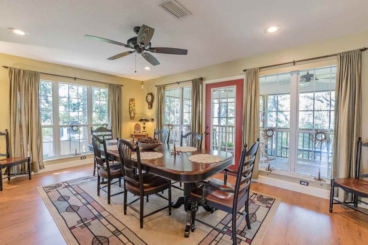 3233 Turtle Creek Road St. Augustine, FL 32086 - Photo 8 of 44 a view of a dining room with furniture window and wooden floor
