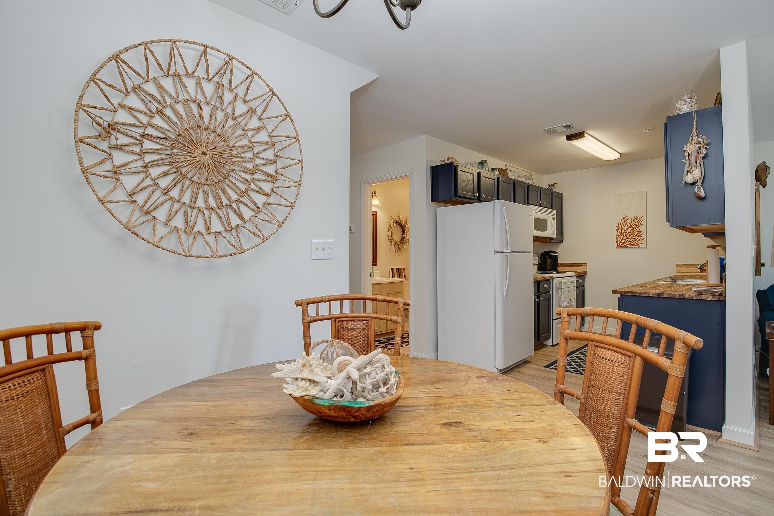 1517 Regency Road, Unit 33 Gulf Shores, AL 36542 - Photo 8 of 29 Dining area featuring visible vents and light wood-style floors