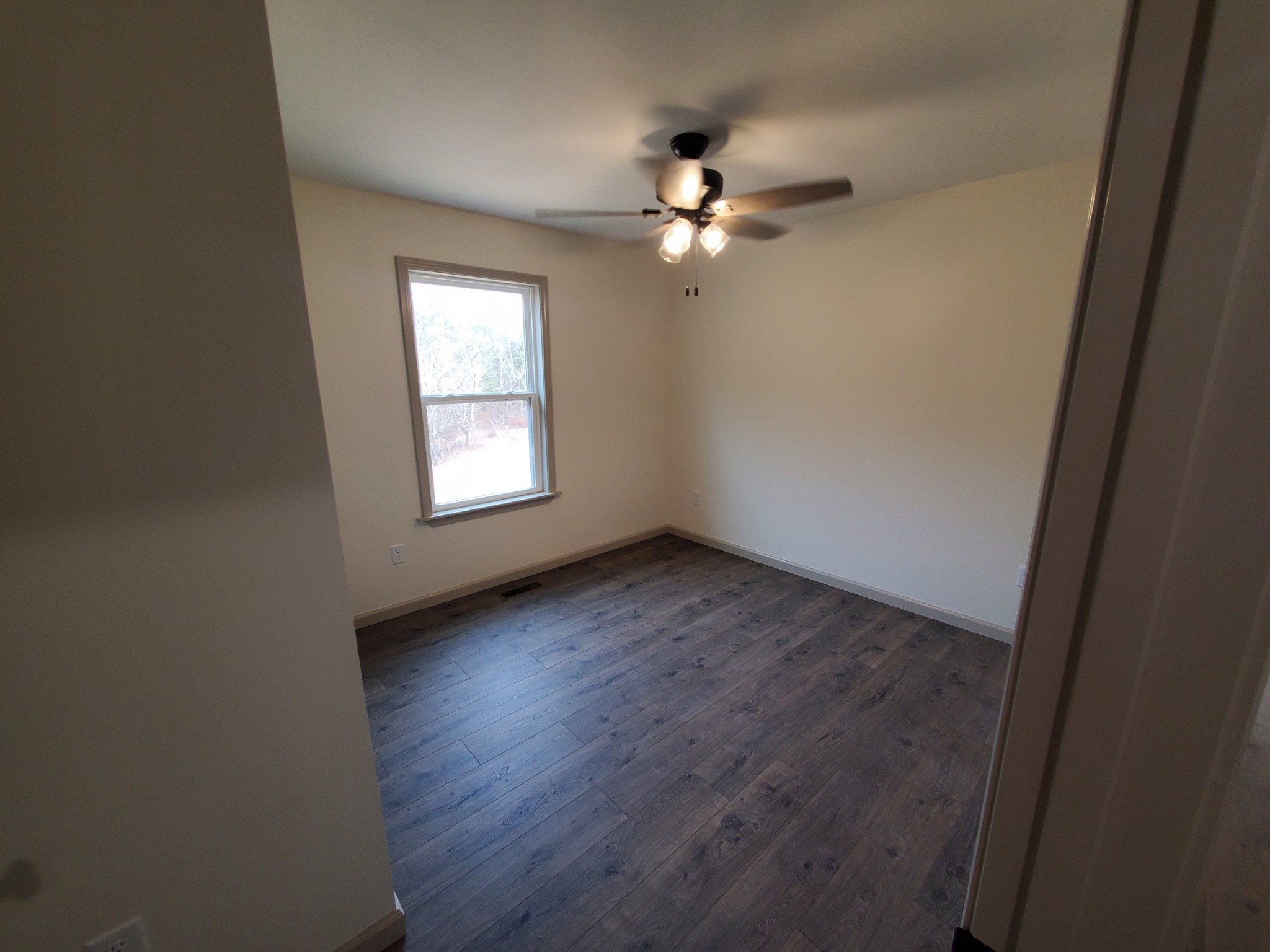 155 Fitzpatrick Road Buffalo Valley, TN 38548 - Photo 8 of 19 wooden floor in an empty room with a window