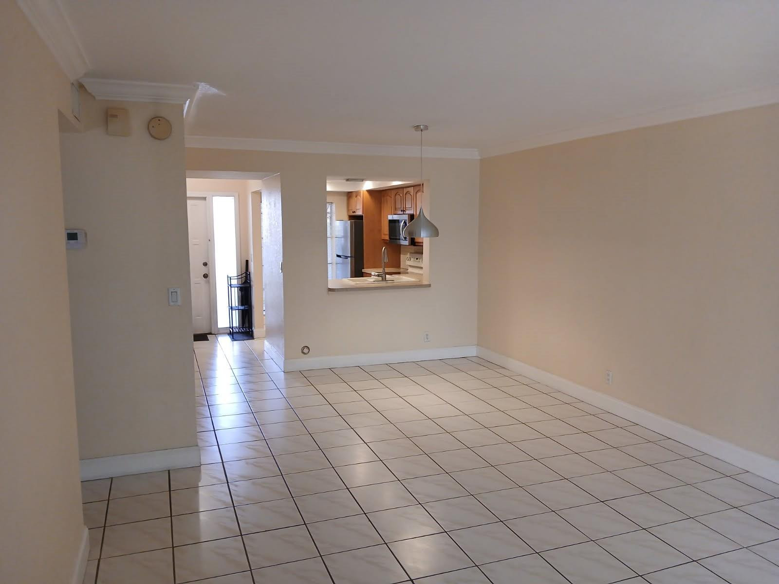 2339 Southwest 15th Street, Unit 19 Deerfield Beach, FL 33442 - Photo 12 of 15 a view of an empty room and window