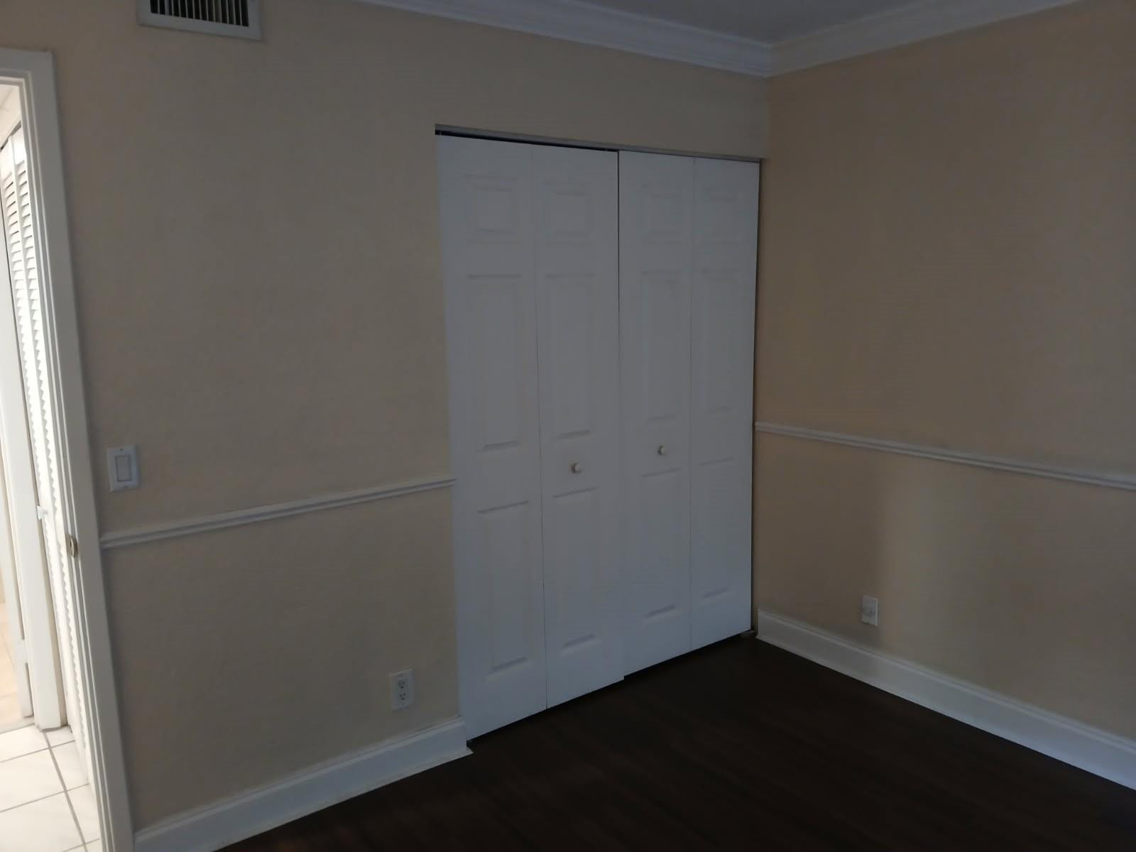 2339 Southwest 15th Street, Unit 19 Deerfield Beach, FL 33442 - Photo 14 of 15 an empty room with a door