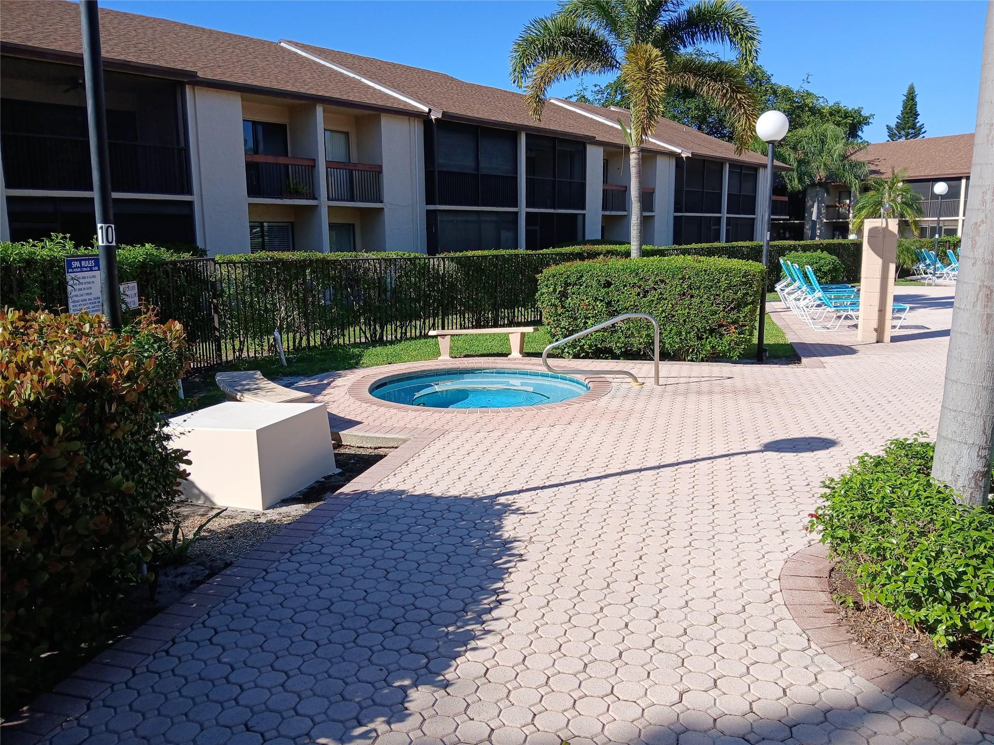 2339 Southwest 15th Street, Unit 19 Deerfield Beach, FL 33442 - Photo 3 of 15 a view of a house with backyard and sitting area