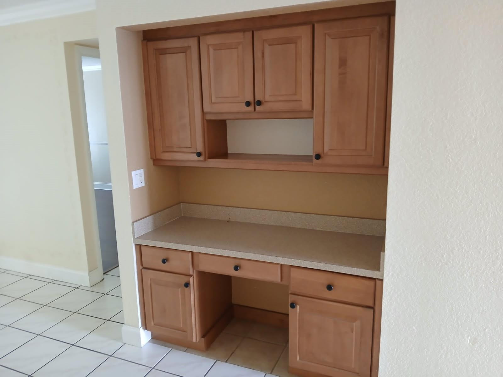 2339 Southwest 15th Street, Unit 19 Deerfield Beach, FL 33442 - Photo 7 of 15 a view of cabinets and window