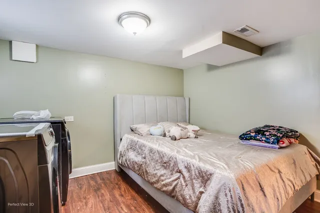 a bedroom with a bed and a dresser