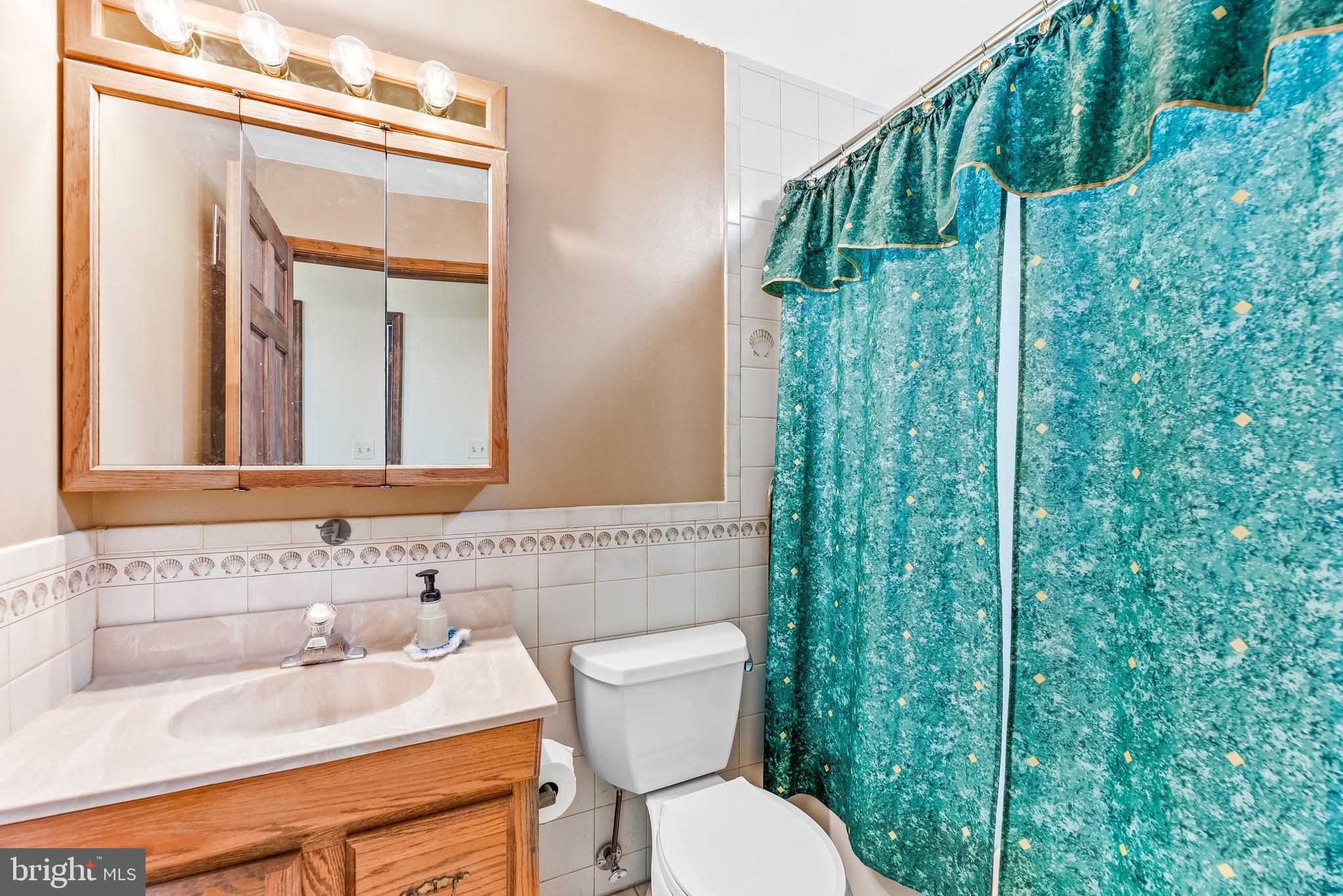 8310 Waverly Road Owings, MD 20736 - Photo 27 of 36 Hallway full bathroom is near bedrooms 3 and 4.