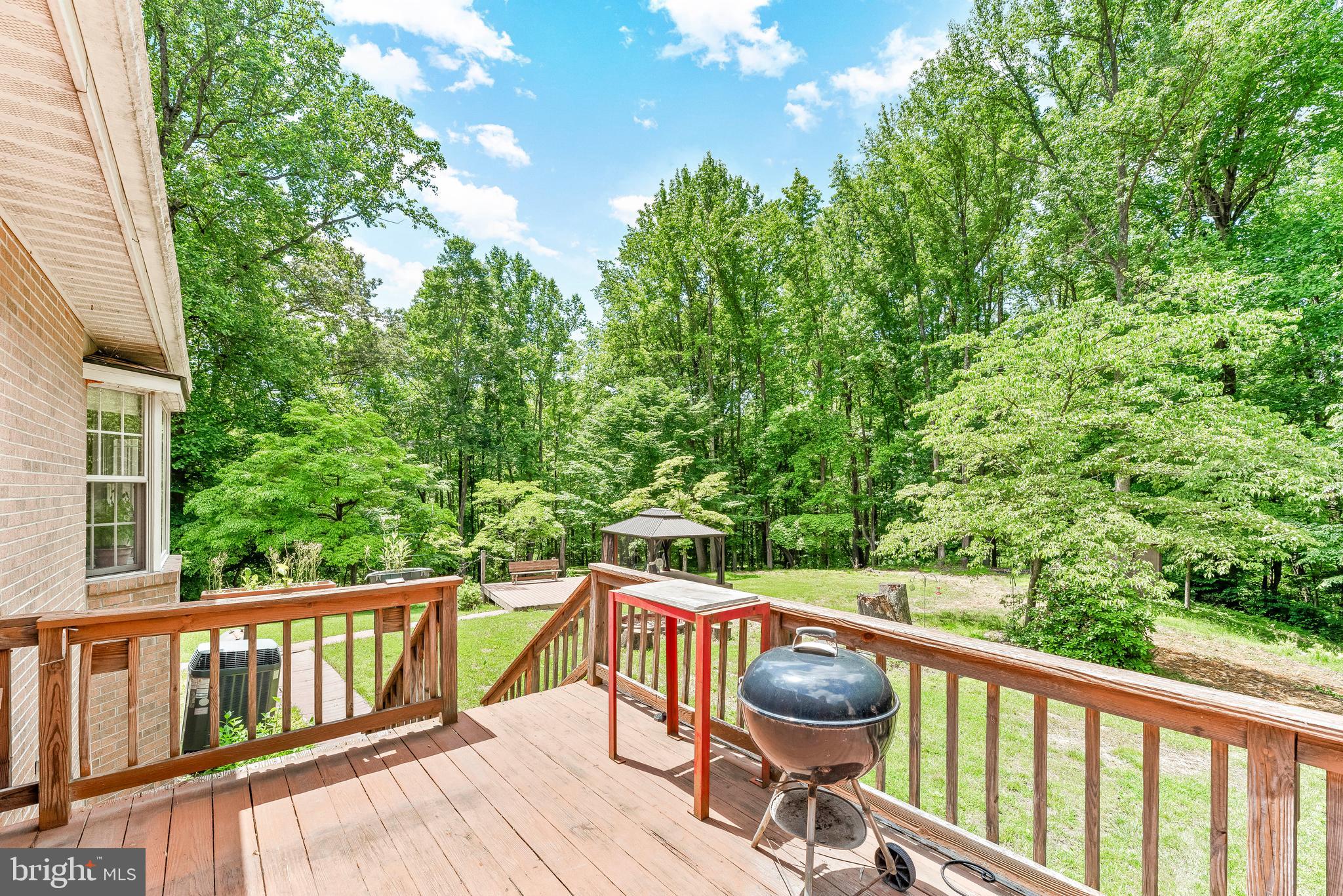 8310 Waverly Road Owings, MD 20736 - Photo 4 of 36 Back deck looking out over the yard and woods.