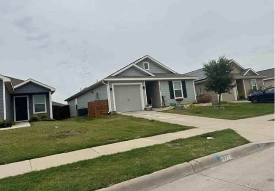 5332 Vinebrook Way Princeton, TX 75407 - Photo 2 of 6 a front view of a house with a yard