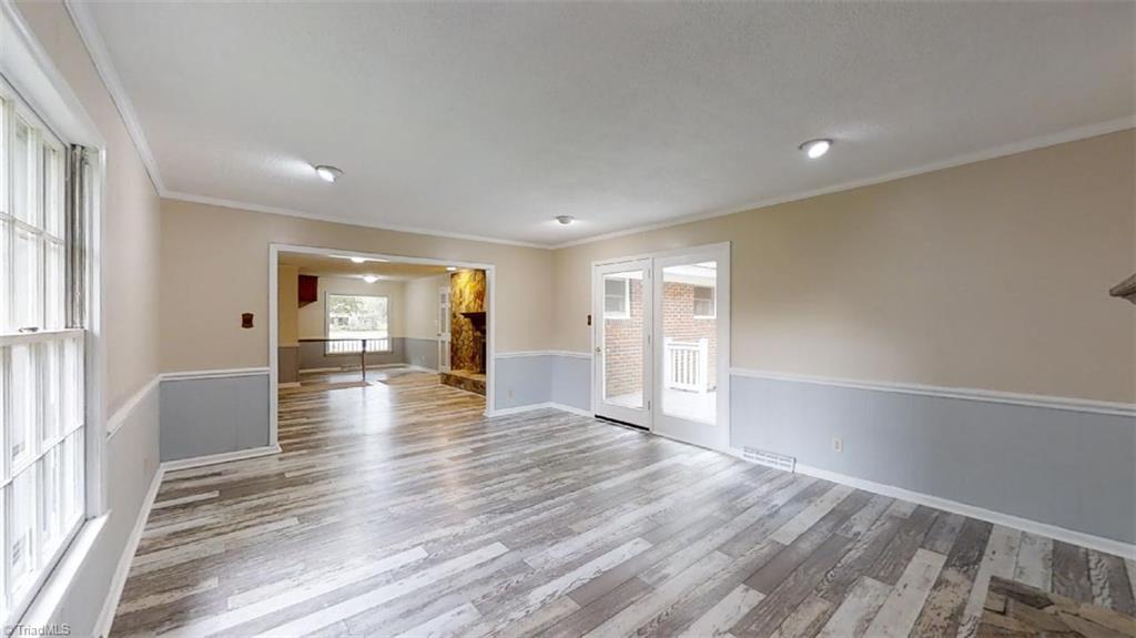 8392 West Harrell Road Oak Ridge, NC 27310 - Photo 11 of 23 View from the den into the dining room & kitchen.