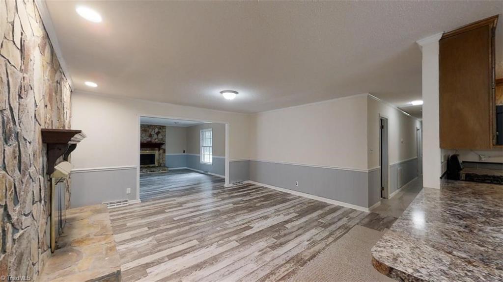 8392 West Harrell Road Oak Ridge, NC 27310 - Photo 12 of 23 Great sight lines from the breakfast bar area into the dining room & den.
