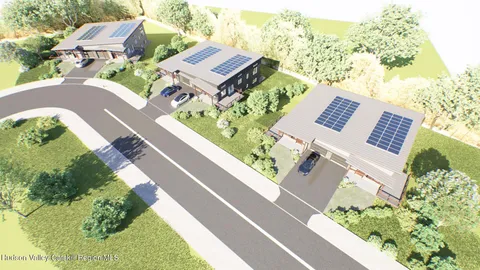 an aerial view of a house with a garden and plants