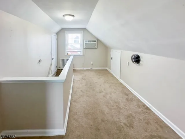 a view of an empty room with stairs