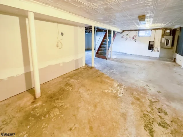 a view of an empty room with stairs