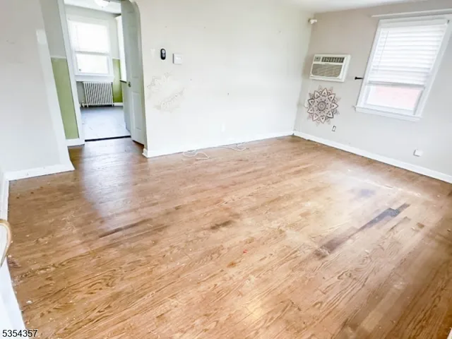 an empty room with windows and entrance