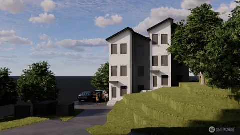 a white building view with a garden space