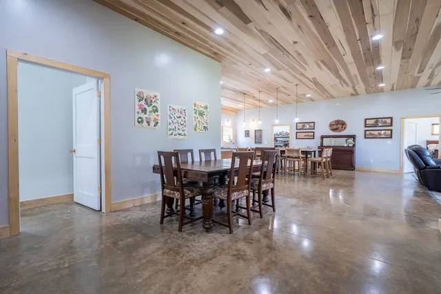 a bathroom with double vanity sinks and a mirror