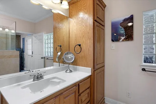 a bathroom with a sink and a mirror