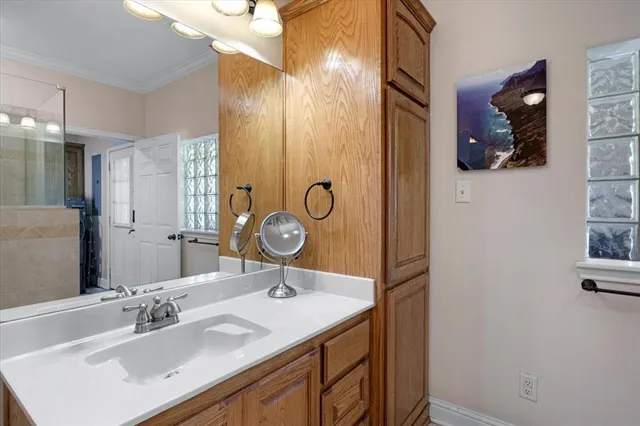 a bathroom with a sink and a mirror