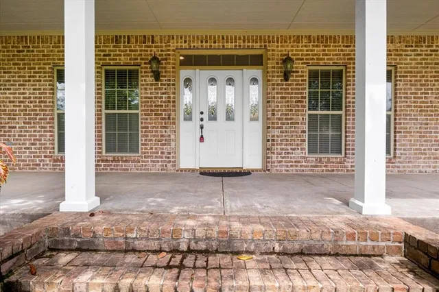 a view of a house with a door and a window