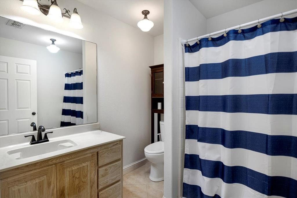 6299 Highway 271 Gilmer, TX 75644 - Photo 21 of 39 a bathroom with a sink and a mirror