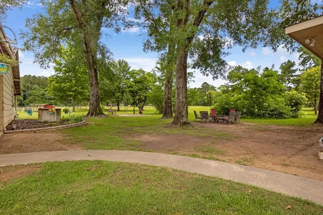 a front view of a house with a garden and porch