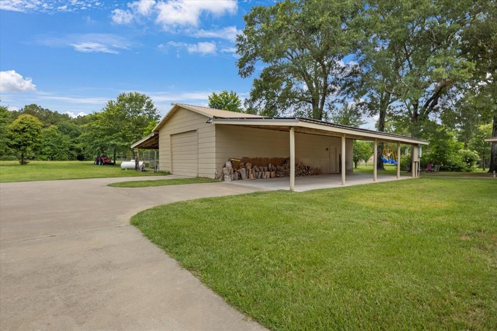 6299 Highway 271 Gilmer, TX 75644 - Photo 25 of 39 a view of a house with backyard and garden