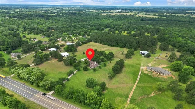 a picture of a bathroom with a window