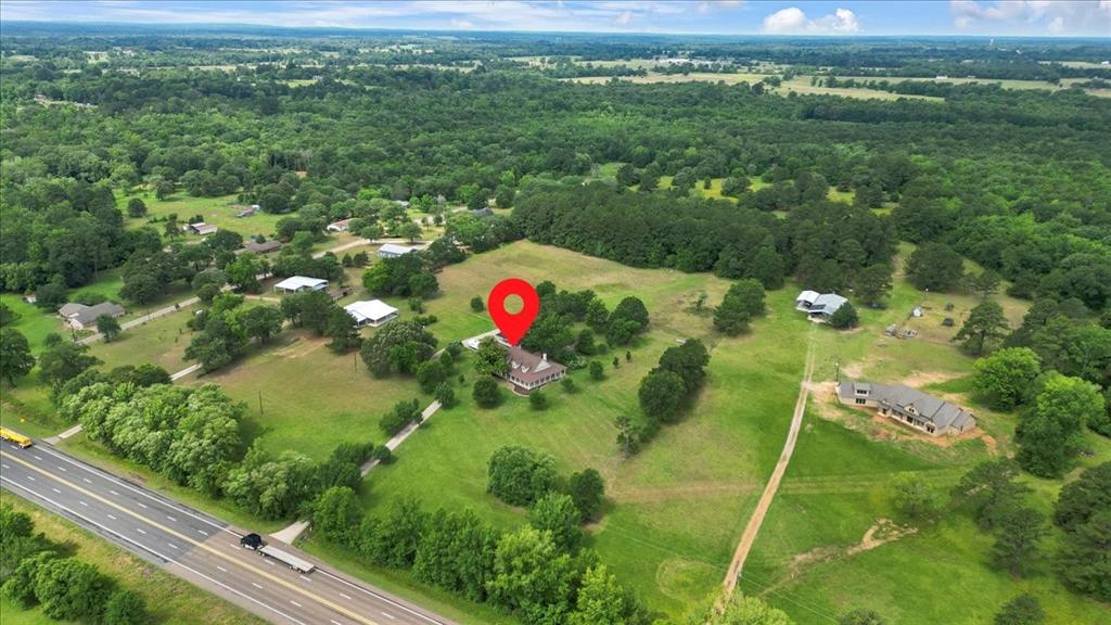 6299 Highway 271 Gilmer, TX 75644 - Photo 36 of 39 a view of a yard with an outdoor space