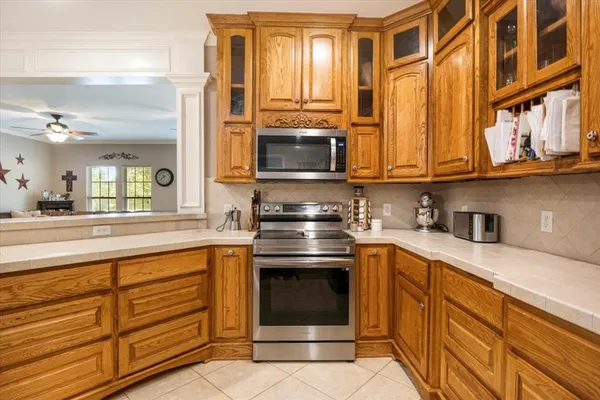 a kitchen with stainless steel appliances granite countertop a stove and a sink