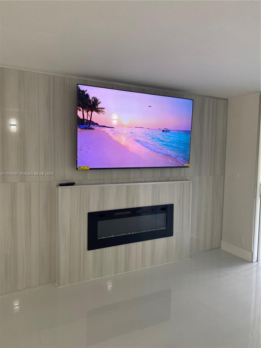 6935 Huntington Lane, Unit 107 Delray Beach, FL 33446 - Photo 1 of 23 a room with an empty room