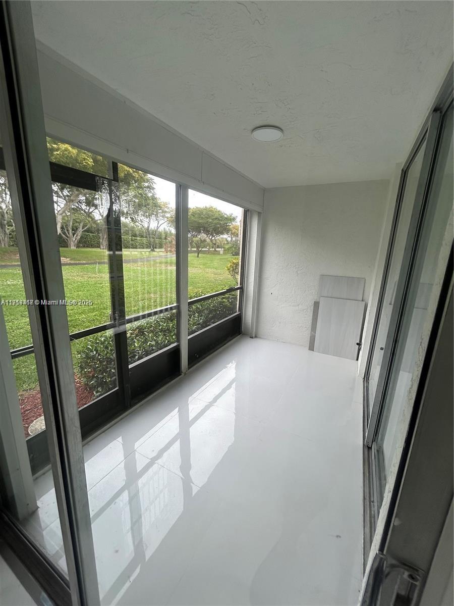 6935 Huntington Lane, Unit 107 Delray Beach, FL 33446 - Photo 15 of 23 a view of a porch