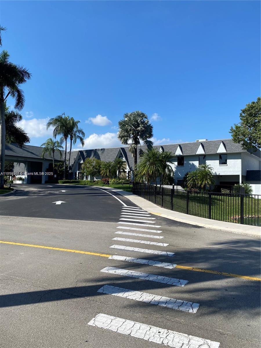 6935 Huntington Lane, Unit 107 Delray Beach, FL 33446 - Photo 20 of 23 a view of a building in the street