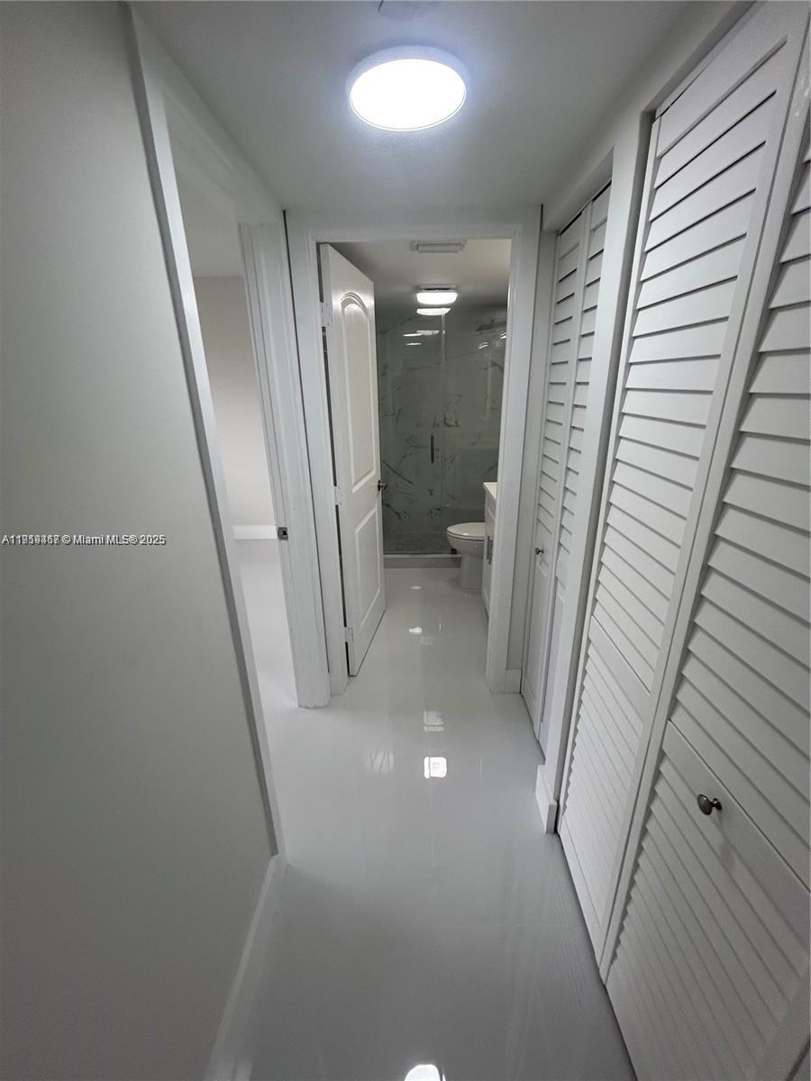 6935 Huntington Lane, Unit 107 Delray Beach, FL 33446 - Photo 8 of 23 a view of a livingroom with a staircase