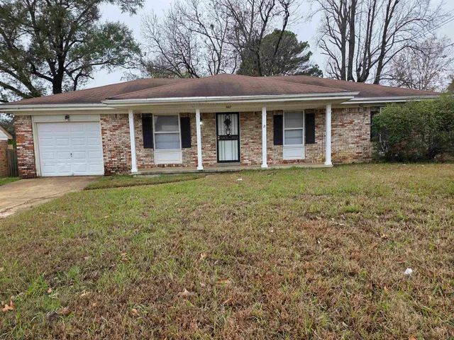 front view of a house with a yard