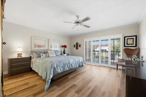 a bed room with a bed and a television