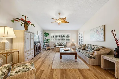 a living room with furniture fireplace and window