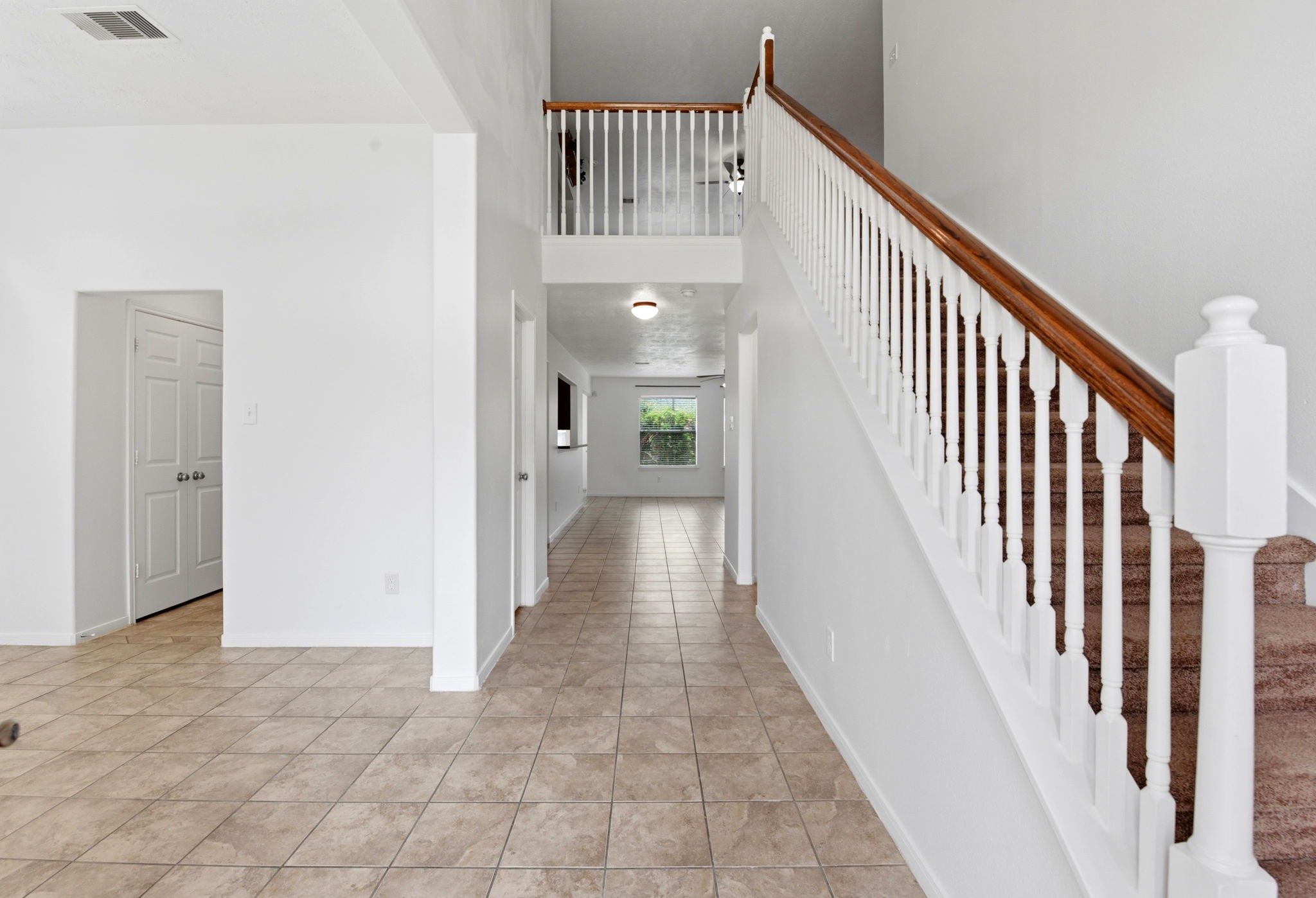 22102 Bridgestone Crossing Drive Spring, TX 77388 - Photo 5 of 38 a view of a hallway with wooden floor and entryway