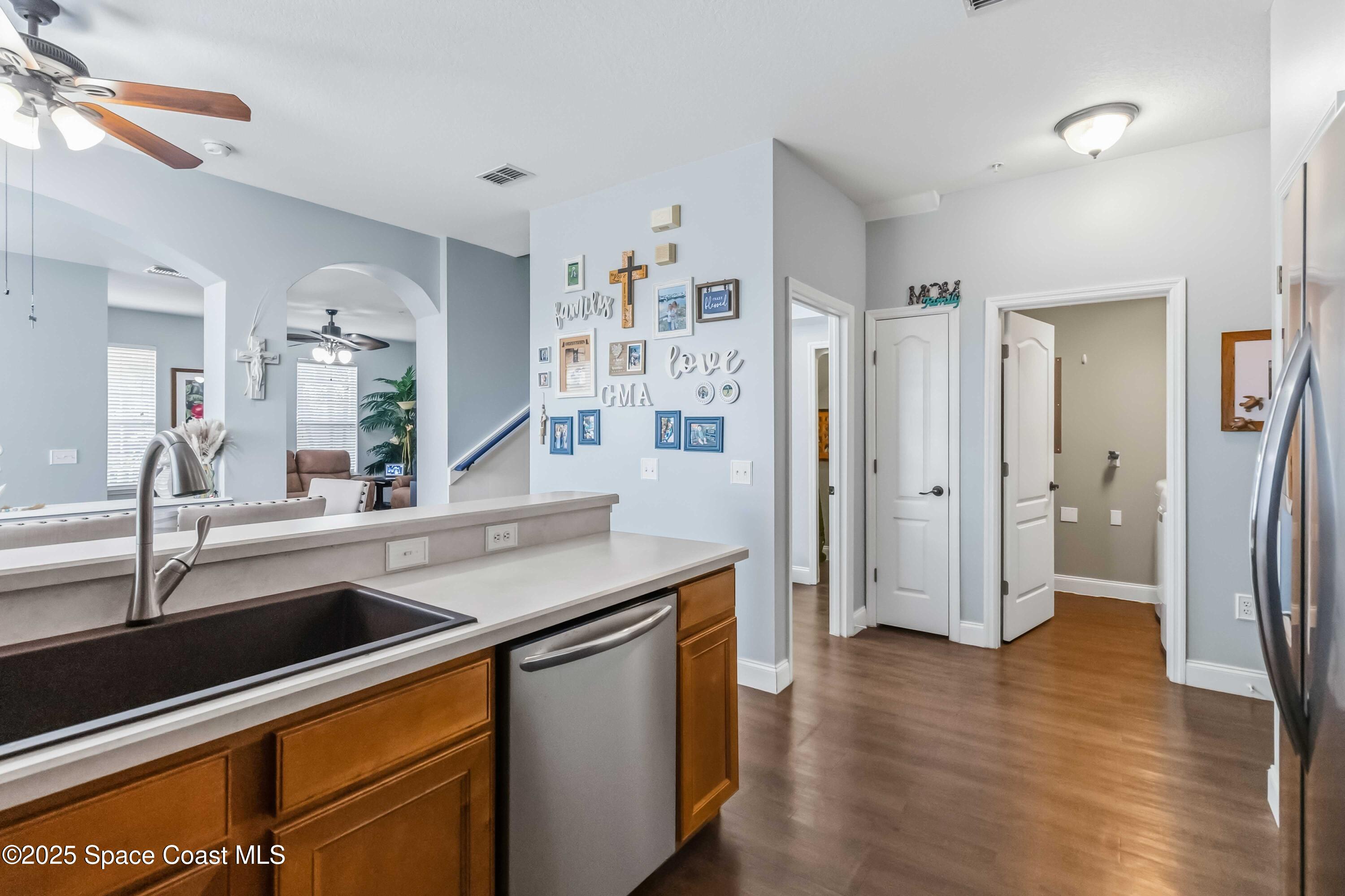 3607 Clay Brick Road Harmony, FL 34773 - Photo 21 of 72 a kitchen with stainless steel appliances granite countertop a refrigerator and a sink