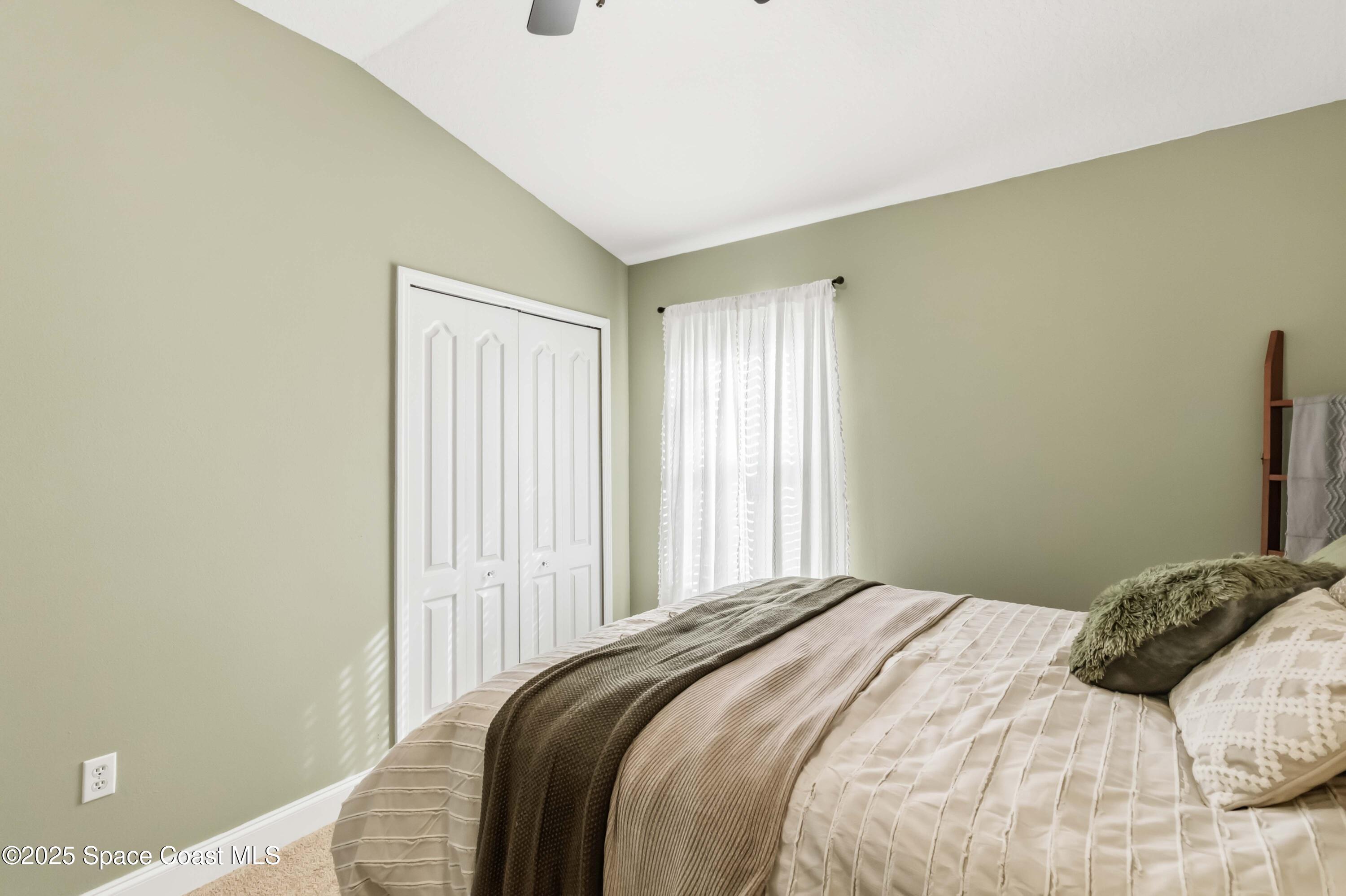 3607 Clay Brick Road Harmony, FL 34773 - Photo 30 of 72 a bedroom with a bed and a window