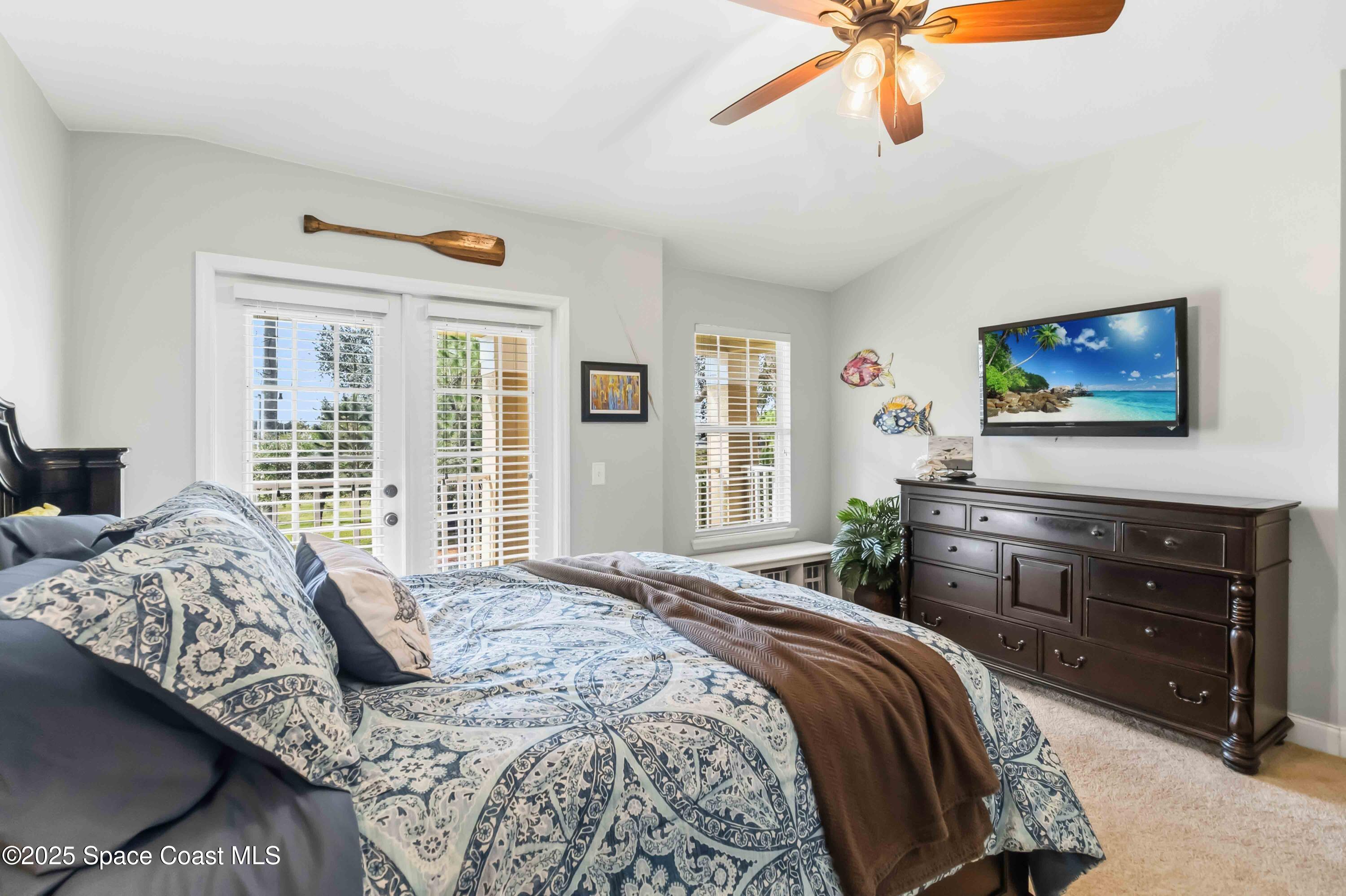 3607 Clay Brick Road Harmony, FL 34773 - Photo 33 of 72 a bedroom with a bed and a flat screen tv
