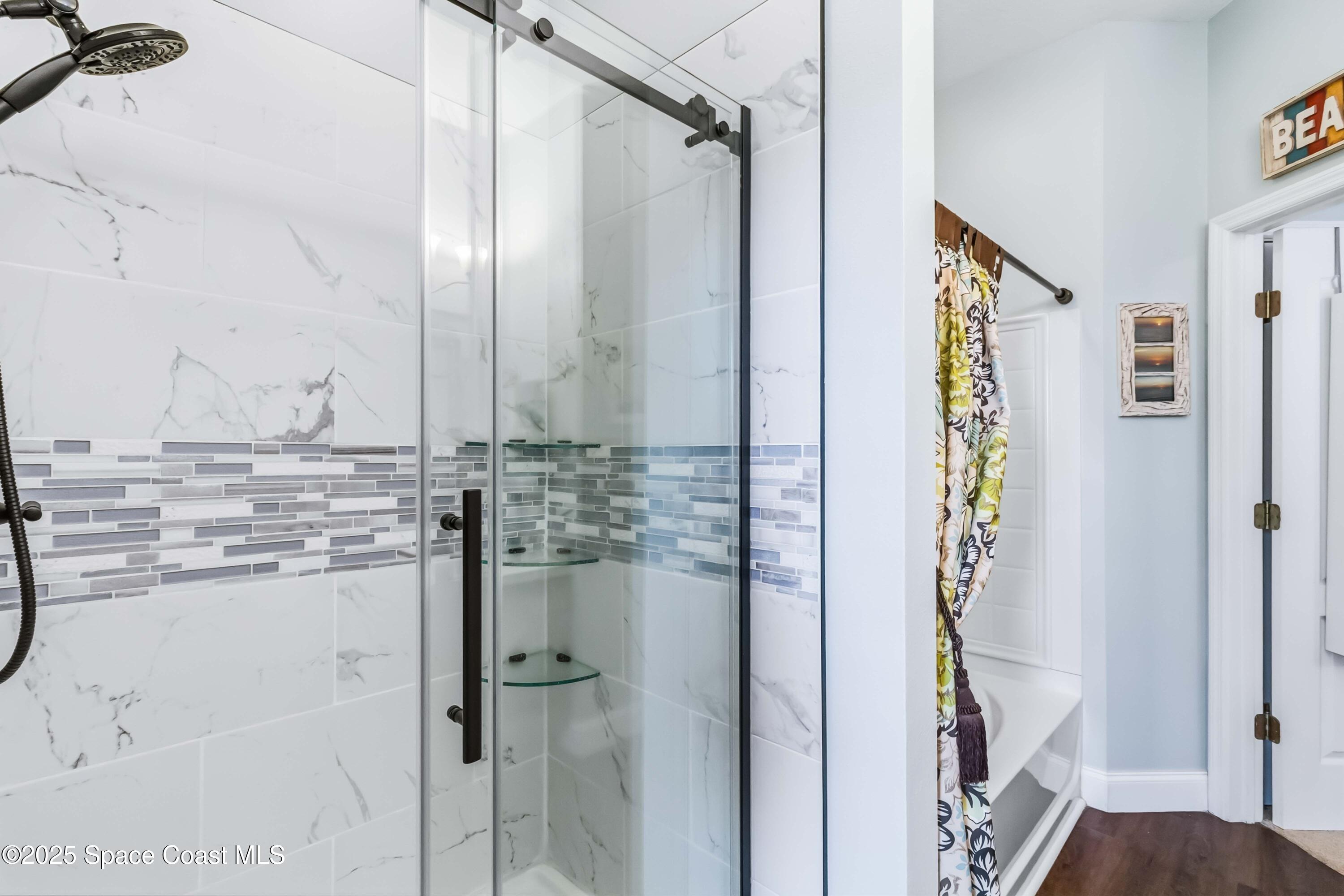 3607 Clay Brick Road Harmony, FL 34773 - Photo 39 of 72 a bathroom with a granite countertop shower and a mirror