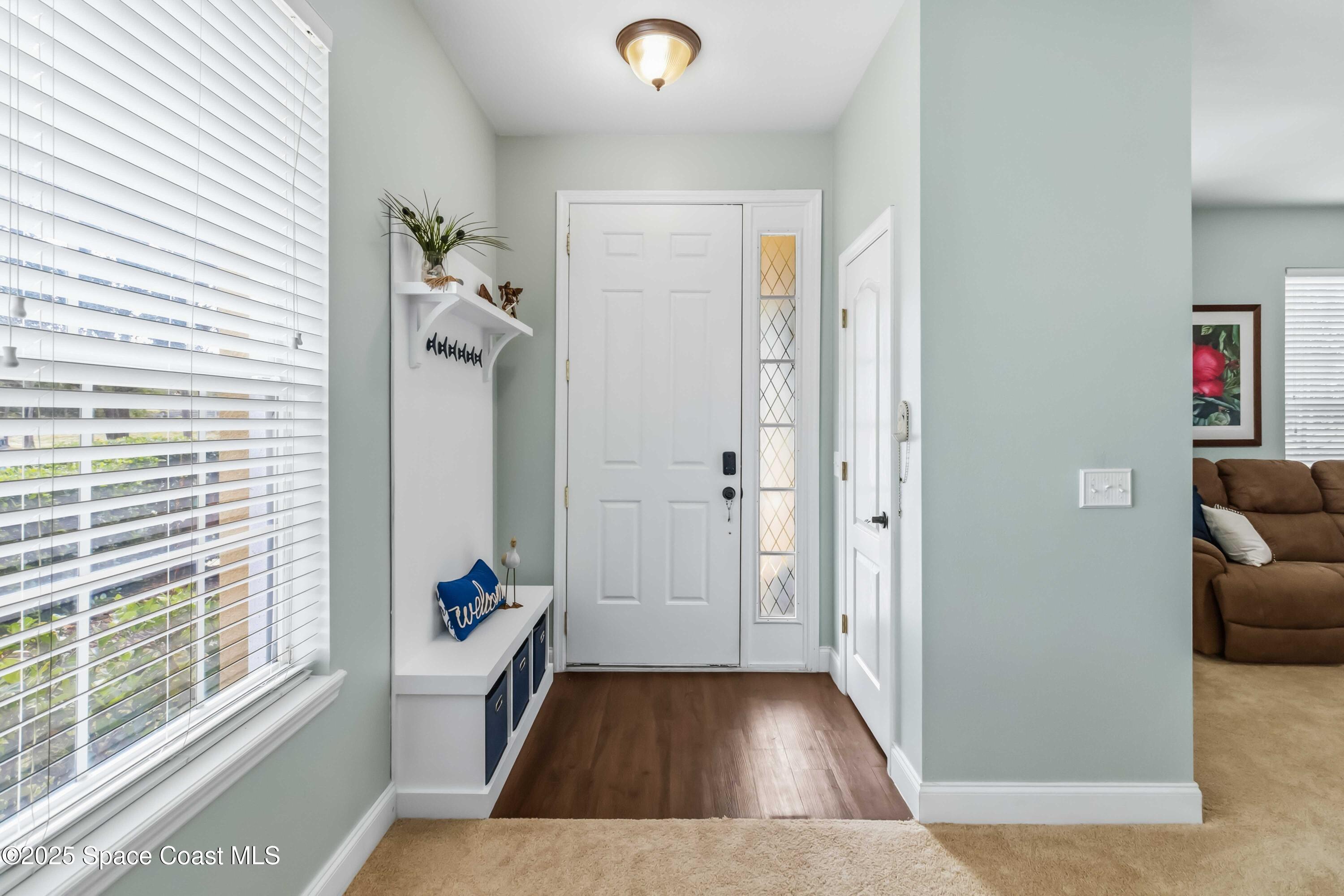 3607 Clay Brick Road Harmony, FL 34773 - Photo 4 of 72 a view of livingroom with hardwood floor and hallway