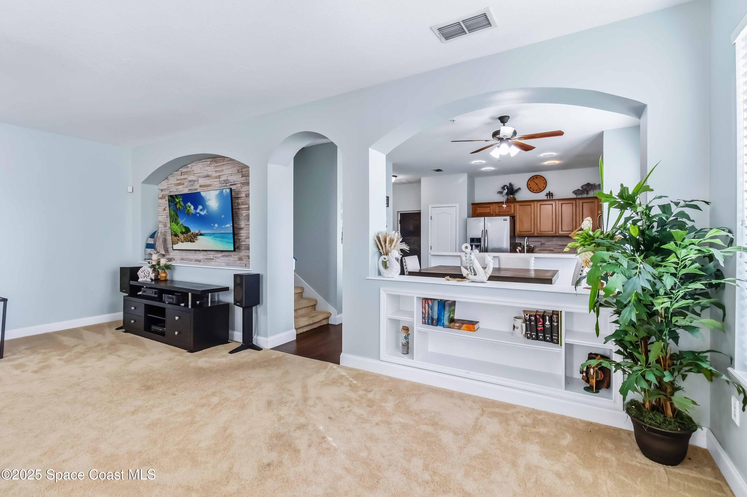 3607 Clay Brick Road Harmony, FL 34773 - Photo 6 of 72 a living room with furniture and flower kitchen