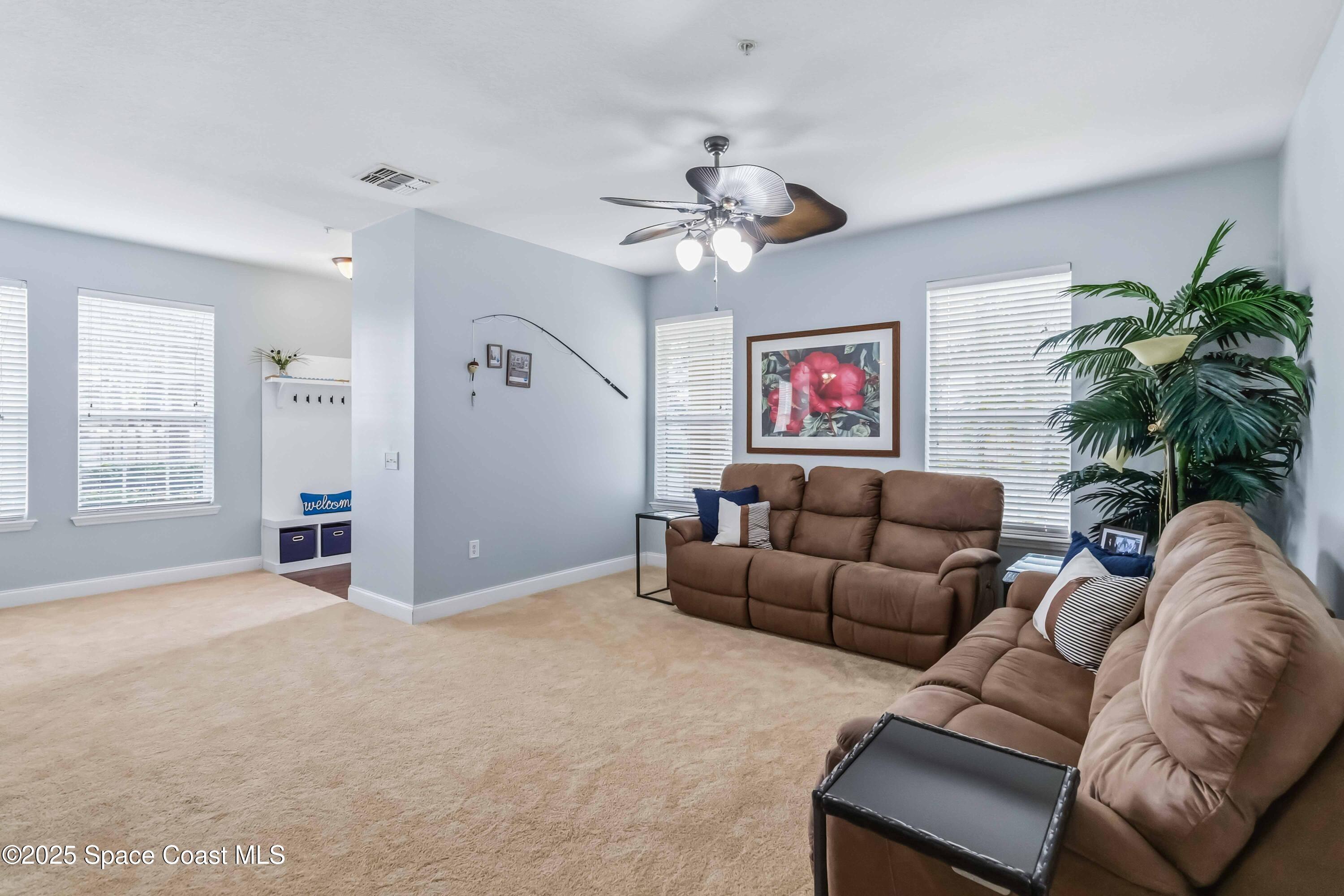 3607 Clay Brick Road Harmony, FL 34773 - Photo 9 of 72 a living room with furniture and a large window