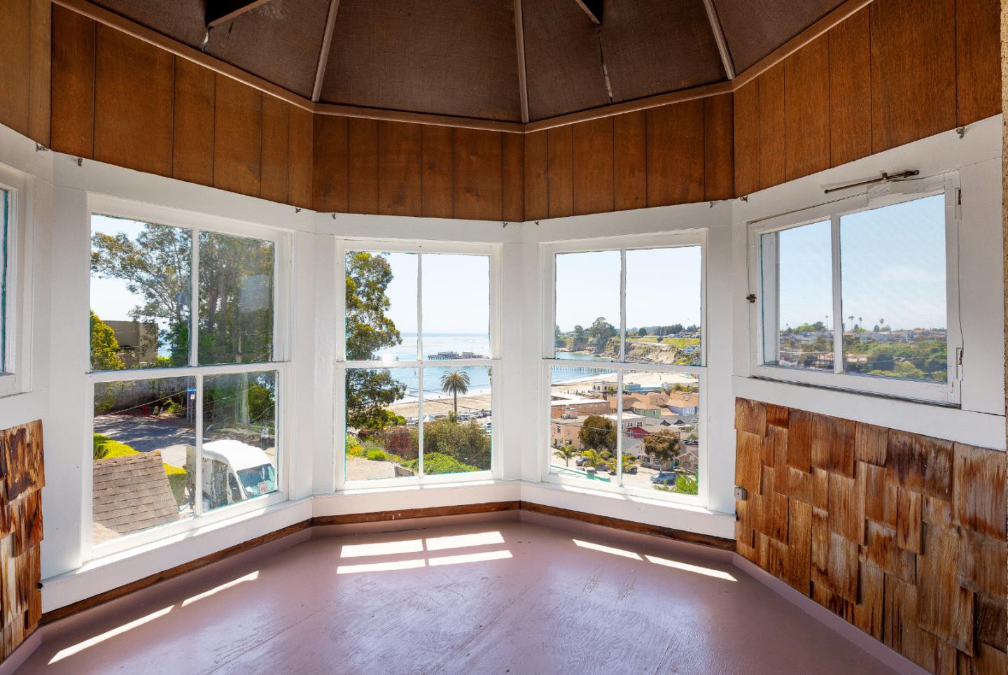 106 Cliff Avenue Capitola, CA 95010 - Photo 11 of 30 a view of a room with wooden floor and windows