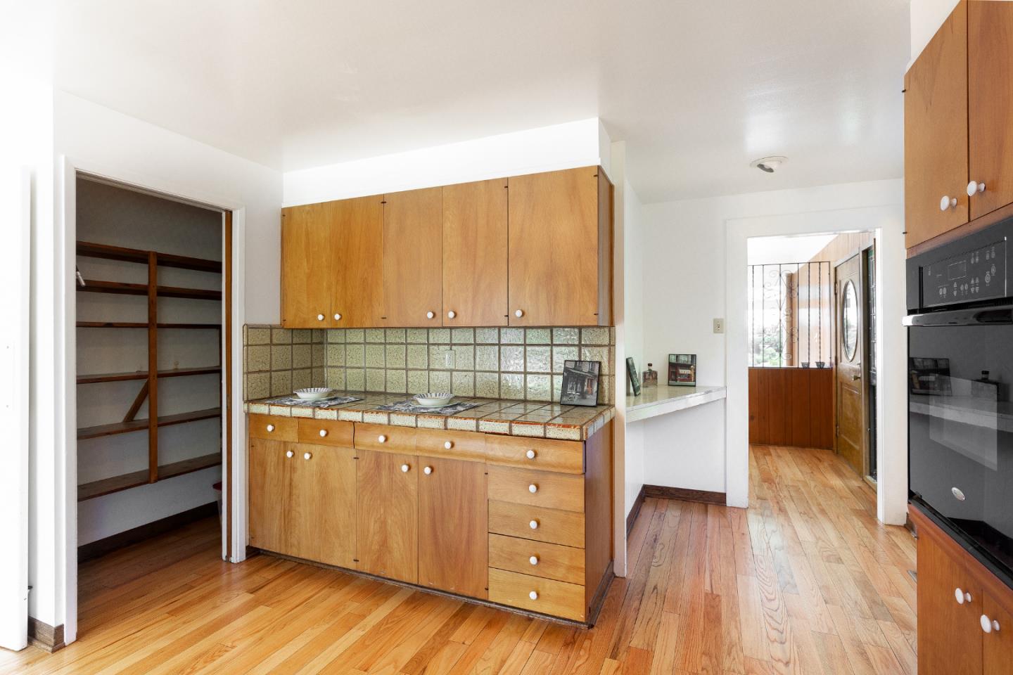 106 Cliff Avenue Capitola, CA 95010 - Photo 21 of 30 a kitchen that has a sink and a stove