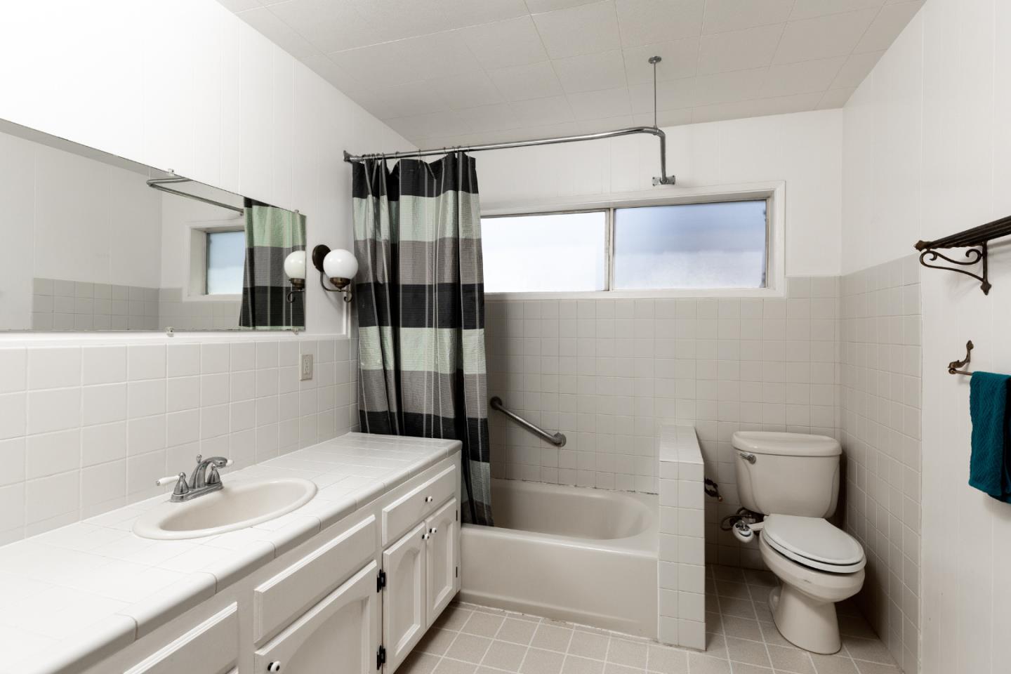106 Cliff Avenue Capitola, CA 95010 - Photo 25 of 30 a bathroom with a sink toilet vanity and tub