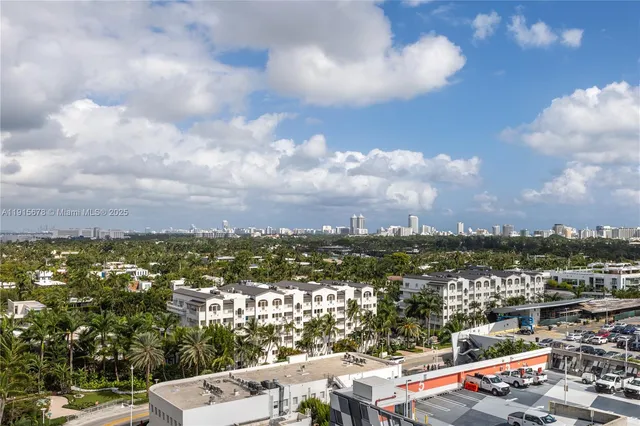 a view of a terrace with furniture and city view