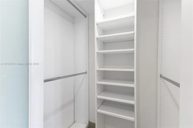 a view of a hallway with washer and dryer